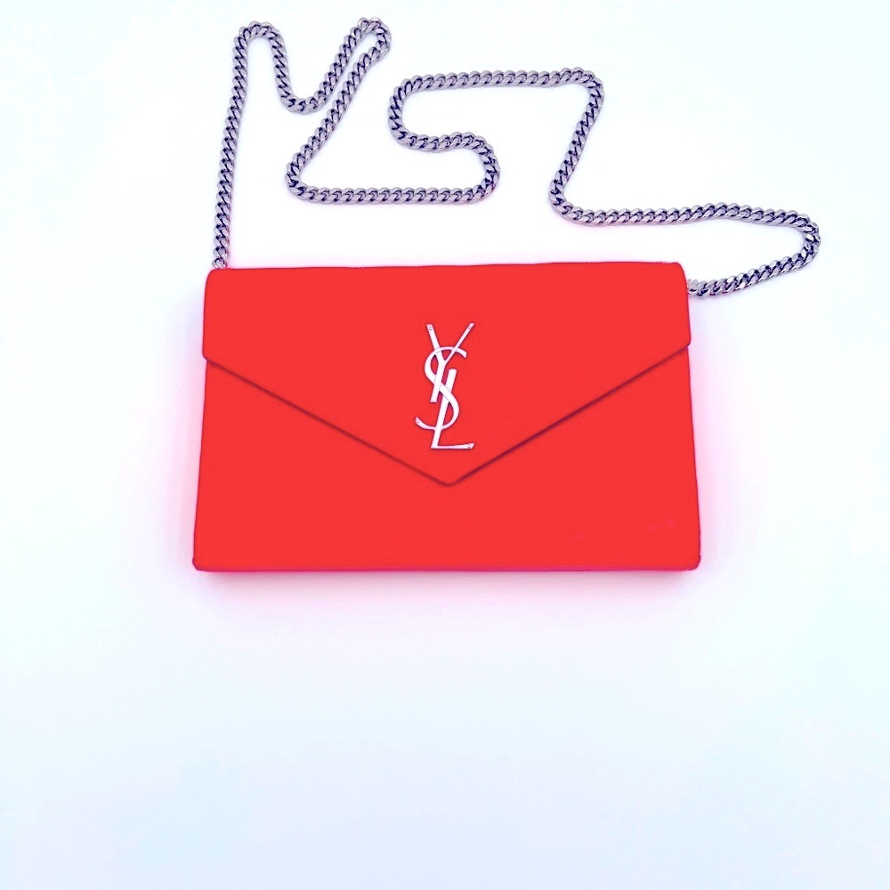 EUC YSL Cassandre neon fuchsia patent leather clutch on a chain.